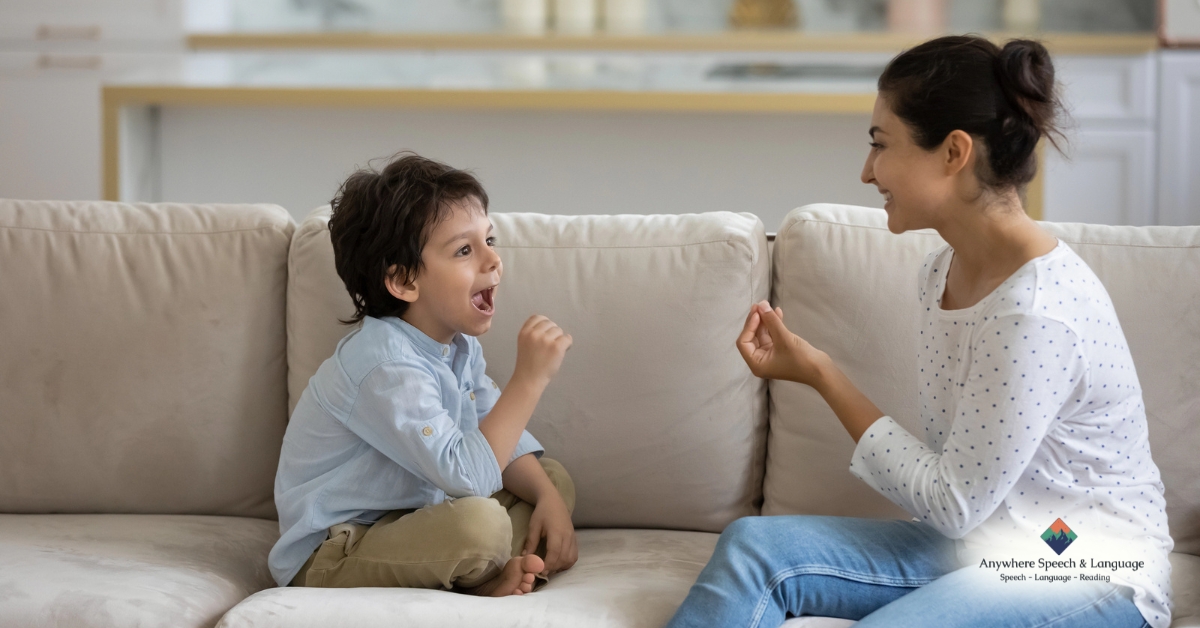 Child practicing oral movements with an adult during speech therapy at home | Anywhere Speech & Language Therapy | Online Speech Therapy Across The United States