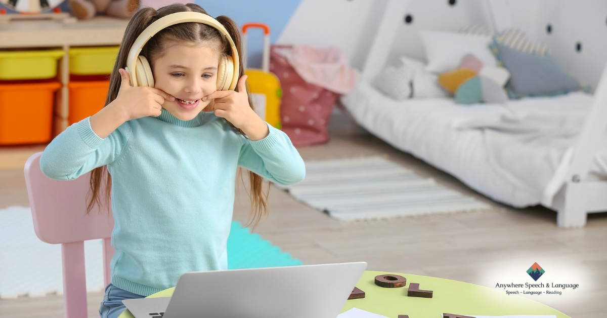 Child wearing headphones during online speech therapy session for tongue-tie support | Anywhere Speech & Language Therapy | Online Speech Therapy Across The United States